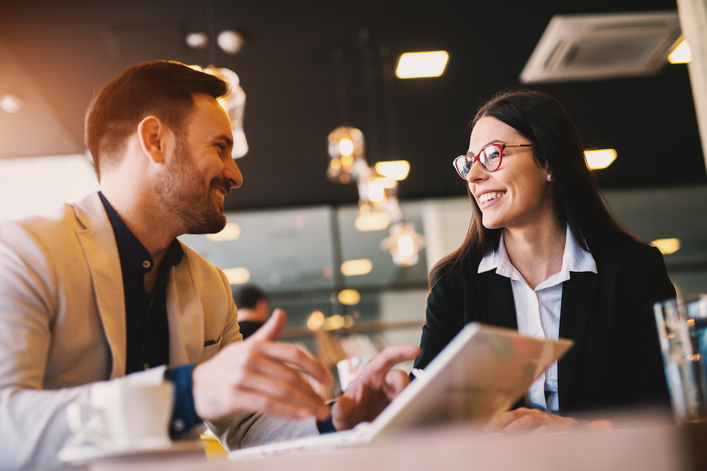 Two business people meeting. A business development representative talking to a customer.