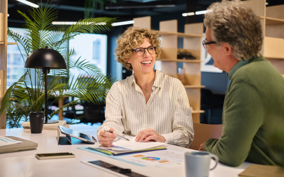 Sales representative having a personalized business conversation with a client during a meeting